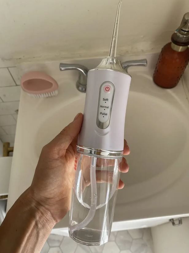 Portable Oral Irrigator – جهاز تنظيف الأسنان بالماء المحمول